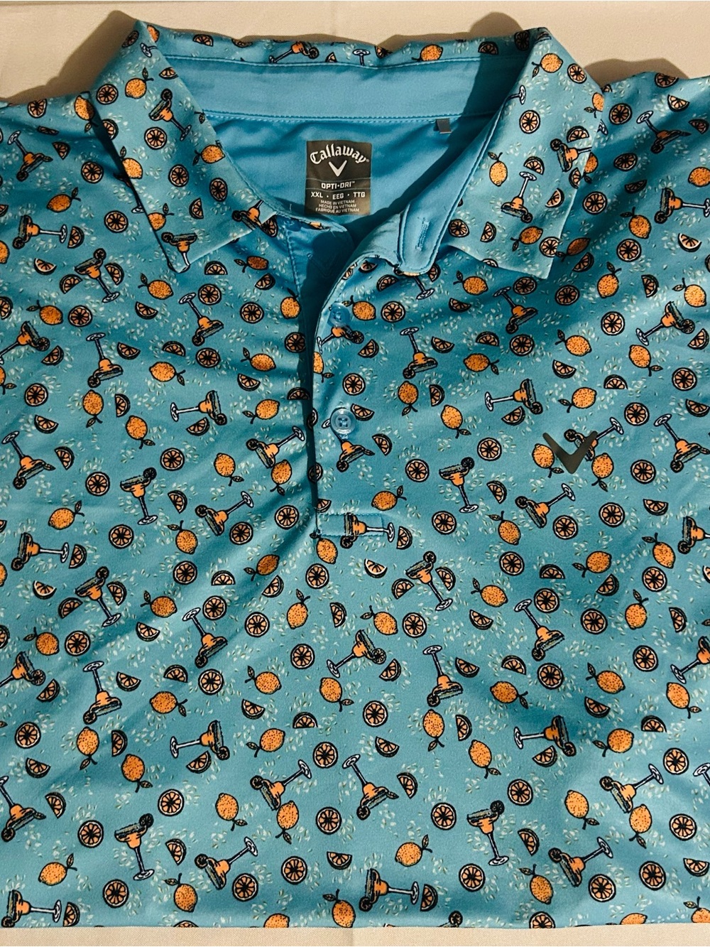Callaway Turquoise Golf Polo with Orange Pineapple & Black Accents